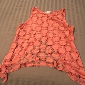 Coral open back asymmetrical bottom tank top with button detail on back